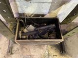 a wooden box with a gun inside of it