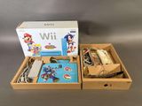Console de jeux Nintendo Wii avec Mario Kart et accessoires, dans une boîte en carton