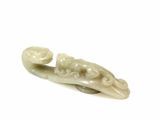 carved ivory figurine of a woman with a flower on her head