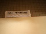 a label that says gilles noulahac on a piece of paper