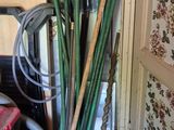 a pile of bamboo sticks and other items in a room