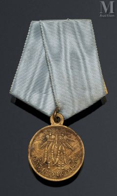 l'image d'une médaille avec un ruban sur fond noir