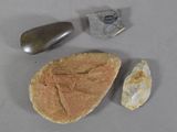 a rock, a rock, and a stone on a table