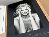 an image of a black and white photo of a woman in a box