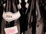 many bottles of wine sitting on a shelf in a store