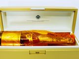 a bottle of alcohol in a box on a table