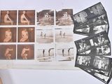 a lot of old black and white photos on the table