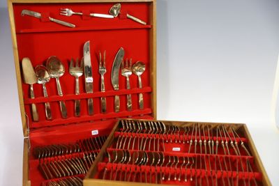 a wooden box with a set of silverware in it