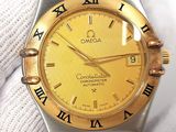 a gold and silver watch with roman numerals on it