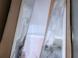 a cardboard box that has a skateboard and other items in it