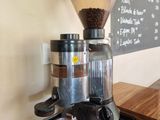 a coffee grinder sitting on top of a counter