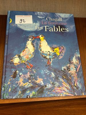 a book that is sitting on a wooden table