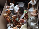 a box full of figurines and a mirror on the table