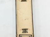 a small model of a military vehicle on a white surface