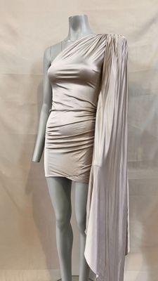 the mannequin is wearing a white dress with a cape over it