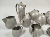 a lot of silver items that are on a table