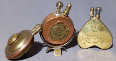 three different types of brass bells are sitting next to each other