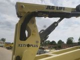 a close up of a yellow crane with a blue sky in the background