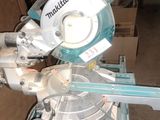 someone is using a circular saw to cut a piece of wood