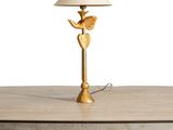 a table with a lamp on top of it on a white background
