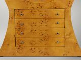 an image of a wooden chest of drawers with a clock on top of it