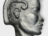 an image of a statue of a man with a mohawk on his head