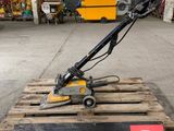 a close up of a machine on a pallet in a warehouse