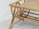 a small wooden table with a magazine rack on it