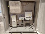 a white box with electrical equipment inside of it