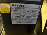 a close up of a parking meter with a sticker on it