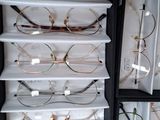 a lot of glasses that are sitting on a shelf