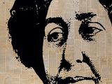 a black and white drawing of a woman on a piece of newspaper