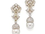 a pair of pearl and diamond earrings
