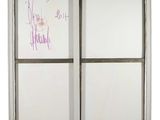 a white board with writing on it in a window