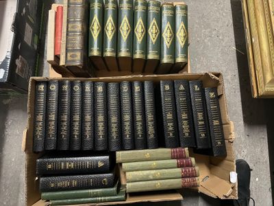 a lot of books in a box on the floor