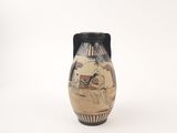 a vase with a picture of a man riding a horse