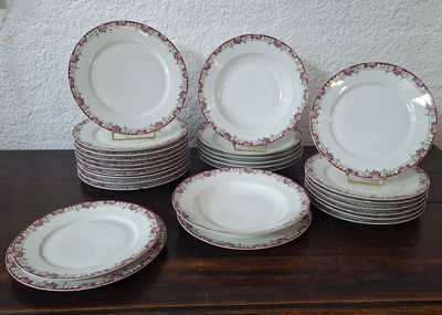 a lot of plates that are sitting on a table
