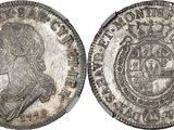 a silver coin with an image of a man on it
