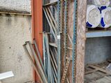 a pile of wood sitting in the corner of a building