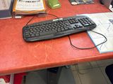 a desk with a keyboard and a monitor on it