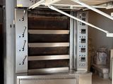 a large oven that is sitting inside of a building