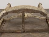 a wooden bench that is sitting on a wooden floor