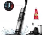 a close up of a black and silver vacuum cleaner and a toothbrush