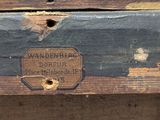 a wooden box with a label on it on a table