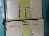 an old refrigerator in the corner of a room with blue tiles