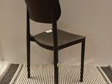 a chair that is sitting on a rug in a room