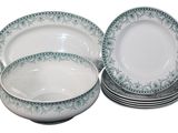 a lot of plates and bowls sitting on a table