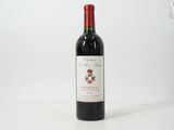 a bottle of wine that is sitting on a table