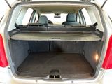the back of a car with the trunk open and the seats folded down