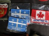 three patches of different colors and designs are on a black shirt